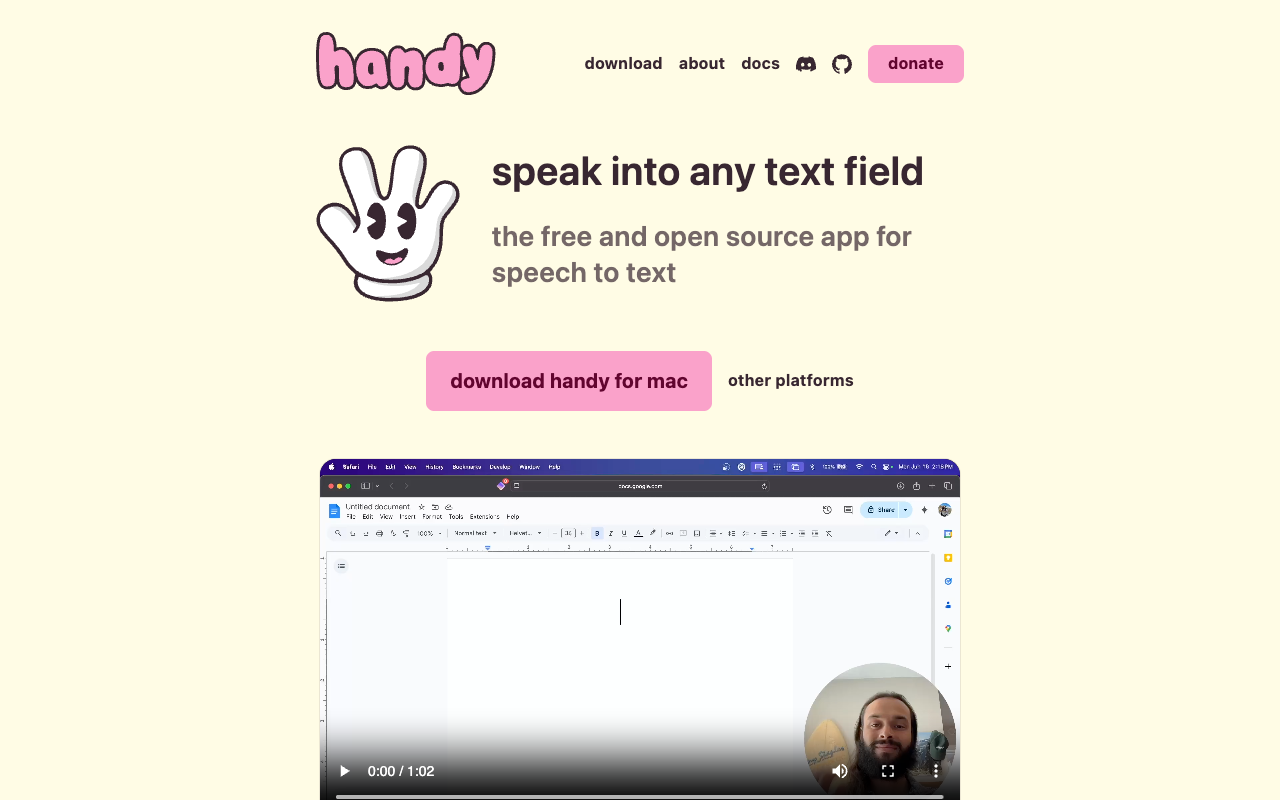 The handy.computer homepage: a cartoon waving hand mascot next to the tagline 'speak into any text field — the free and open source app for speech to text', with a download button for Mac